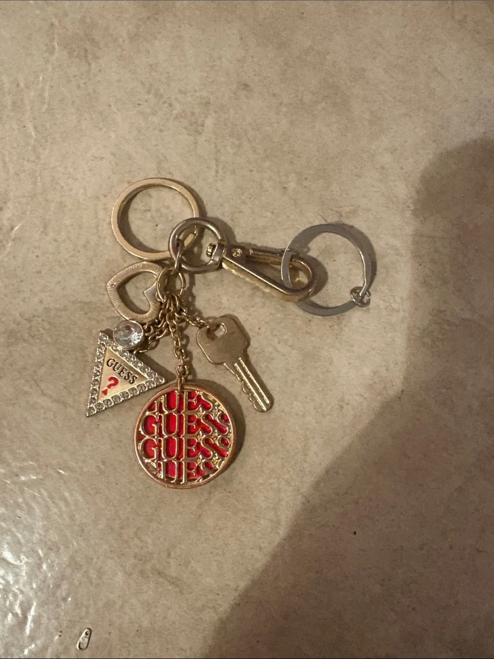 GUESS Gold-Tone Keychain with Red Logo Disc and Triangle Charm